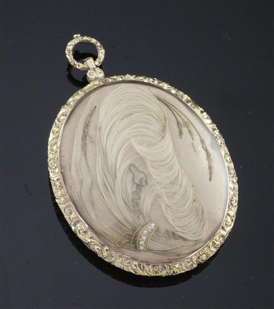 An oval Victorian daguerreotype mourning pendant, overall 3.25in. including hanging loop